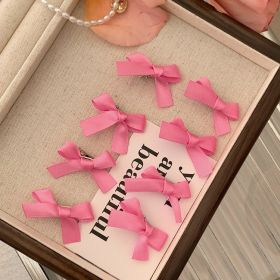 8 Pink Ribbon Bow Hair Clips On The Forehead